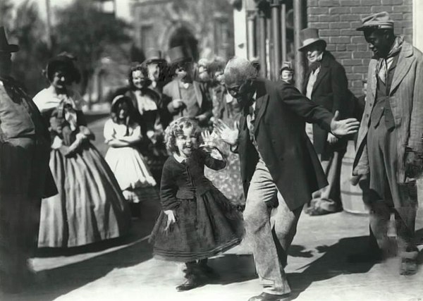 Shirley Temple and Bill Robinson perform a street dance