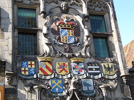 Heraldic shields of the Delft Water Board members on the façade of the Gemeenlandshuis