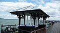 English: A shelter along Ryde Pier, Ryde, Isle of Wight. It is seen still sealed off by police tape, after a violent attack a few months earlier in March 2010.