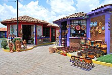 Shops with various pottery crafts in Metepec ShopsCraftVillMet.JPG