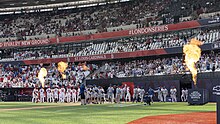 Players and coaches of both teams are introduced before the first game of the series Team Mildenhall Airmen support MLB London Series (7883003).jpg