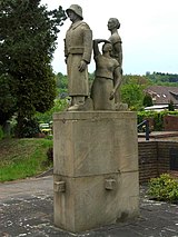 Cemetery cross and war memorial