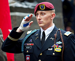 U.S. Army 1st Lt. Alexander Woody, with the 82nd Airborne Division, stands for the national anthem during a ceremony celebrating the U.S. Army's 237th birthday in Times Square June 14, 2012, in New York 120614-A-AO884-084.jpg