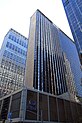 A large skyscraper called the New York Hilton Midtown, in daylight in 2013