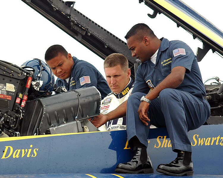 File:US Navy 060227-N-0050T-063 Aviation Machinist's Mate 1st Class Patrick Palma, left, and U.S. Marine Sgt. Deo Harrypersaud, right, prepare Busch Series NASCAR driver Mark McFarland, prior to a VIP demonstration flight.jpg