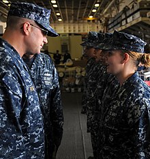 Captain Erik M. Ross, executive officer of the USS Bataan (LHD-5), conducts a personnel inspection on August 9, 2010. US Navy 100809-N-4649B-059 Capt. Erik Ross onducts a personnel inspection.jpg