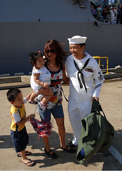 File:US Navy 110727-N-YF783-046 Electrician's Mate 1st Class Eugene Andal greets his wife and children during a homecoming celebration for USS Mason (DD.jpg