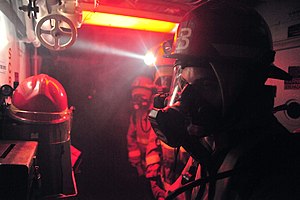 US Navy 120121-N-OP638-092 Sailors assigned to the Arleigh Burke-class guided-missile destroyer USS Porter (DDG 78) prepare to enter a smoke-filled.jpg