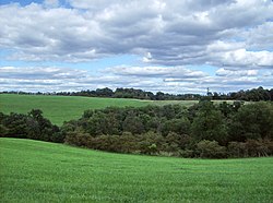 Hills with fields and woods in Lee Township