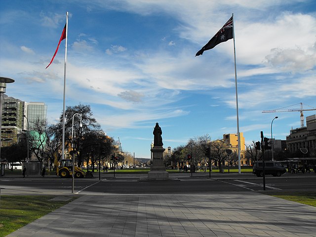The Australian National Flag and the Australian Aboriginal Flag in Victoria Square, with the statue of Queen Victoria in the background, 2008.