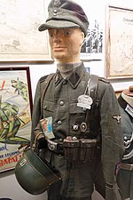 Thumbnail for File:WW2 frontkjemper Norw. volunteer regiment Nordland Waffen SS uniform, songbook, Nazi decorations, helmet, dogtag, Norske Legion Skijegerbataljon poster, etc Lofoten krigsminnemuseum Norway 2019-05-08 DSC09952.jpg