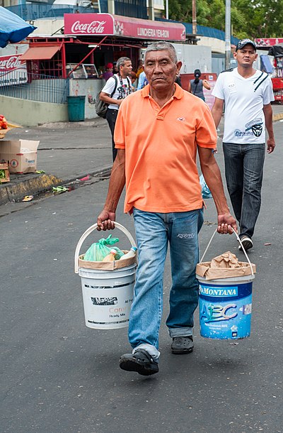 Open-head plastic pails being reused to carry other items