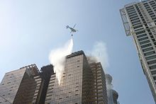 South Korean firefighters in the 2010 Wooshin Golden Suites fire used a helicopter as part of their operations to put out a cladding fire that rose within minutes from the 4th to the 38th floor. Wushinfire78.jpg