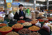 A Tajik dry fruit seller Young Tajikistani dry fruit seller.jpg