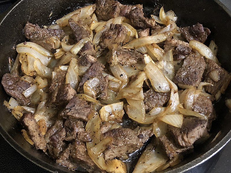 File:2020-04-25 18 40 02 Beef and onion in a cast iron skillet in the Franklin Farm section of Oak Hill, Fairfax County, Virginia.jpg