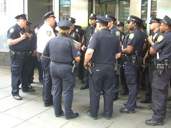 New York City Police Department lieutenant debriefing police officers at Times Square