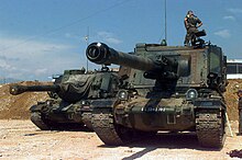 Two French Army Giat GCT 155mm (155 mm AUF1) Self-propelled Guns, 40th Regiment d' Artillerie, with IFOR markings are parked at Hekon base, near Mostar, Bosnia-Herzegovina, in support of Operation Joint Endeavor AMX AuF1, 40e regiment d'artillerie, Implementation Force, 1996.jpg