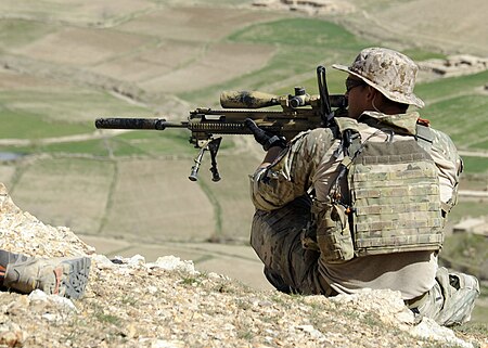 Tập_tin:A_coalition_Special_Operations_Forces_member_fires_his_sniper_rifle_from_a_hilltop_during_a_firefight_near_Nawa_Garay_village_(120403-N-MY805-202).jpg