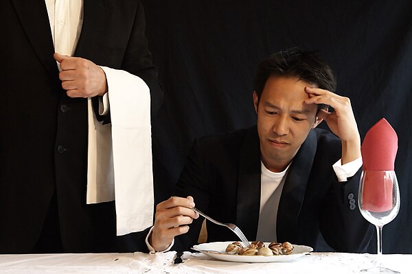 Eating with fork at a restaurant