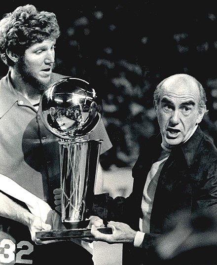 Walton and Portland coach Jack Ramsay holding the NBA championship trophy in 1977