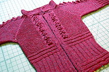 A sweater made with knitted fabric. Bobbles and welting.jpg