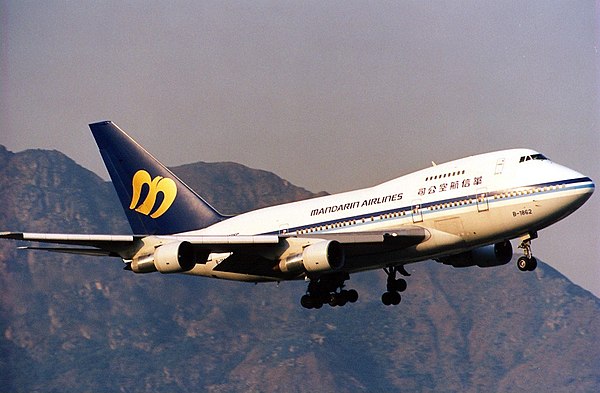 A Boeing 747SP landing at Kai Tak Airport in Hong Kong in December 1996. The 747-SP was one of the first aircraft in the fleet and was acquired from C