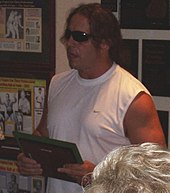 Hart accepts his induction into the George Tragos/Lou Thesz Professional Wrestling Hall of Fame, July 15, 2006 Bretplaque.jpg