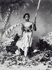 19th-century studio portrait of a native Javanese warrior with an iron kris-tipped spear COLLECTIE TROPENMUSEUM Studioportret van een krijgsman uit Djokja TMnr 60040120.jpg