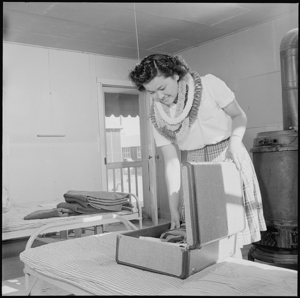 File:Closing of the Jerome Relocation Center, Denson, Arkansas. Mitzi Matsunaga packs her dresses just p . . . - NARA - 539753.tif