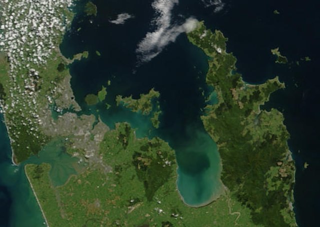 True-colour image showing the Hauraki Gulf / Tīkapa Moana, with Auckland (left) and the Coromandel Peninsula (right), by NASA's Terra satellite, 2002.