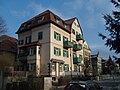 Apartment building with back building in open development