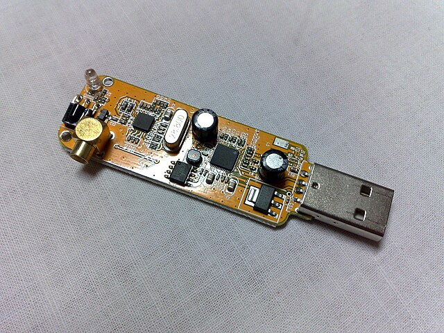 Internals of a low-cost DVB-T USB dongle that uses Realtek RTL2832U (square IC on the right) as the controller and Rafael Micro R820T (square IC on th