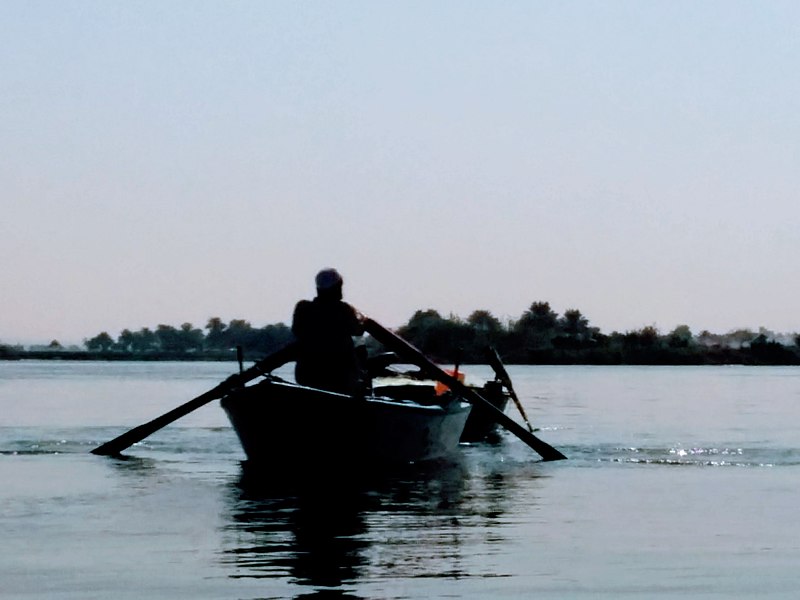 File:Fisher at dawn in the Nile.jpg