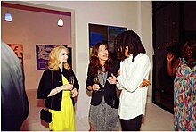 Gillian Wynn Early at Genesis fine art exhibition LA April 2018. Gilian Wynn Early speaking with Genesis the Greykid at his exhibition in LA.jpg