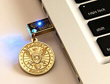 A GoldKey security token connected to a laptop GoldKey Security Token.jpg