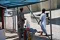 Image:Guard_talks_with_a_captive_in_camp_four_--_the_white_uniform_shows_he_is_a_compliant_captive.jpg