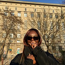 Henrietta Smith-Rolla (Afrodeutsche) standing outside The Berghain, Berlin