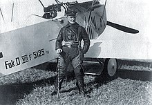 Hermann Goering commander of Jagdgeschwader 1 (World War I) beside his Fokker DVII 5125/1918. He holds a walking stick ("Geschwader Stock") that had been owned by The Red Baron Manfred von Richthofen. Herman Goering 1918 Jasta 11.jpg