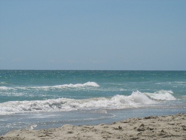 The crystal-water beaches that give the area its name