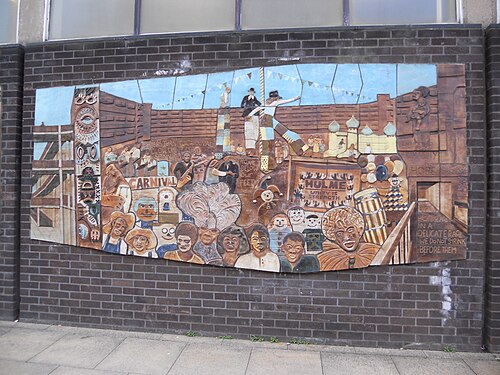 Hulme Library mural detail, showing a Hulme Carnival in Charles Barry Crescent