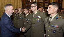 Italian Defense Minister Lorenzo Guerini greets NCOs, who wear paratroopers, Alpini, and TRAMAT gorget patches Italian Army - Italian Defense Minister Lorenzo Guerini visits the Army General Staff.jpg
