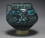 Jug with Running Animals.1150-1220. Iran (Kashan) Seljuk period. Silhouette ware. 13x14 cm. Jug with Running Animals.png