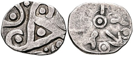 Pre-Mauryan (Ganges Valley) Kurus (Kurukshetras) coin, c. 350–315 BCE. AR 15 Mana – Half Karshapana (15 mm, 1.50 g). Triskeles-like geometric pattern/aix-armed symbol.[20]