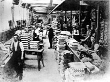 Workers producing shuttles for the textile industry, c. 1920. Rowland Baguley and Company, based on Addison Street, produced a wide range of shuttles for the home textile industry and for export before it closed in the early 1930s.