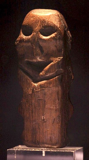 An oak figurine found in Willemstad, the Netherlands, dating from around 4500 BC. On display in the Rijksmuseum van Oudheden in Leiden. Height: 12.5 cm (4.9 in).