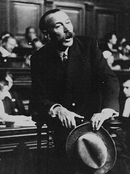 Marcel Guillaume [fr], a celebrated French police commissioner, pictured giving evidence in 1932. He has been seen as a possible inspiration for Maigr