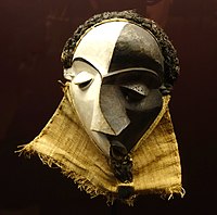 Mbangu mask; wood, pigment & fibres; height: 27 cm; by Pende people; Royal Museum for Central Africa (Tervuren, Belgium). Representing a disturbed man, the hooded v-looking eyes and the mask's artistic elements – facd surfaces, distored features, and divided colour – evoke the experience of personal inner conflict. Picasso copied a mirror image of this Pende mask in "Les Demoiselles d'Avignon"