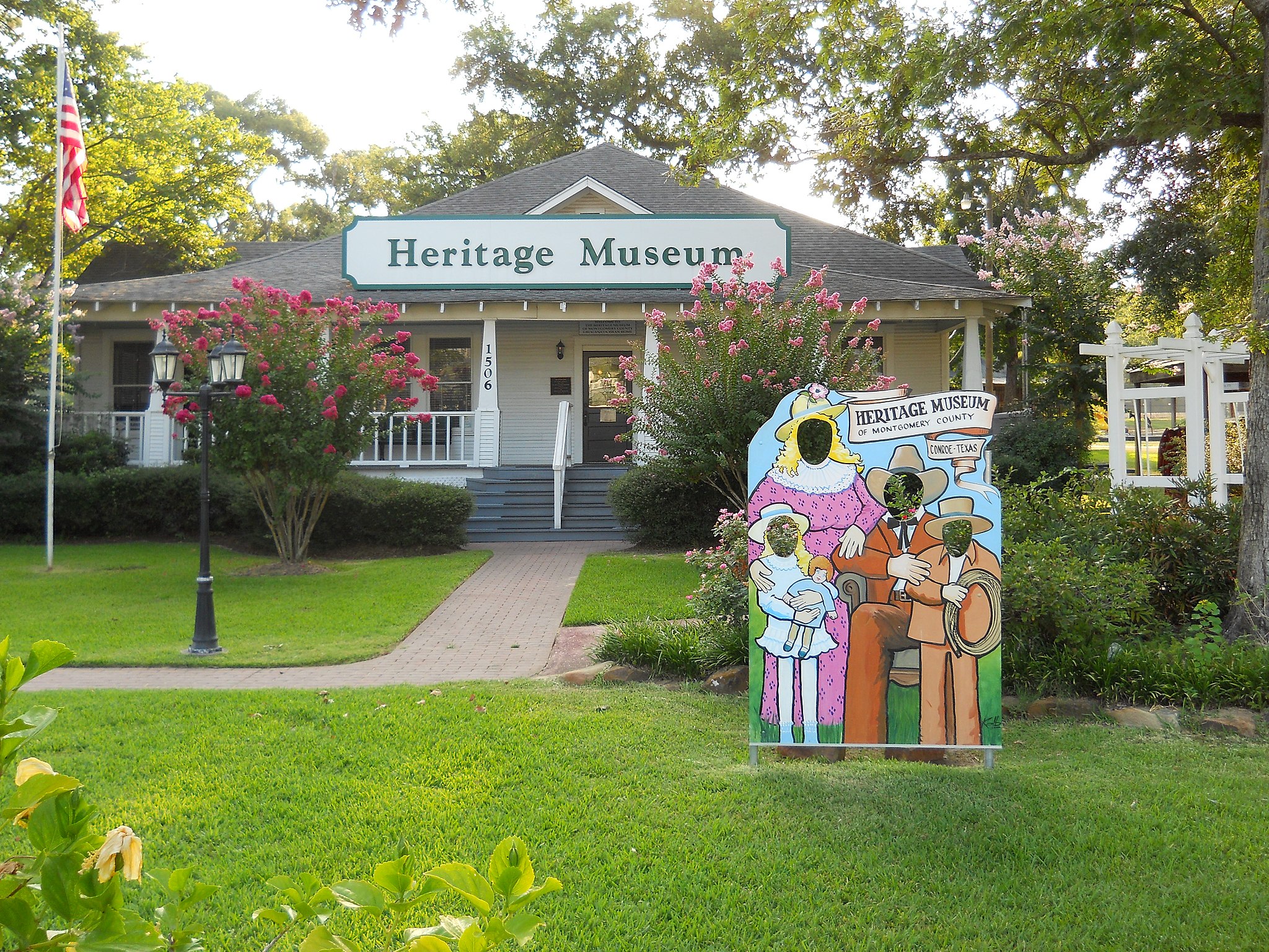 front facade of the montgomery county heritage museum housed in a white craftsman building