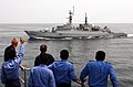 U.S. and Pakistan Navy personnel "Thumbs up" to his shipmates aboard PNS Shah Jahan in the Exercise Inspired Siren in the Indian Ocean in 2002.