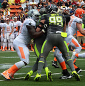 Watt during the 2014 Pro Bowl Philip Rivers, JJ Watt, Nick Mangold 2014 Pro Bowl (cropped).jpg